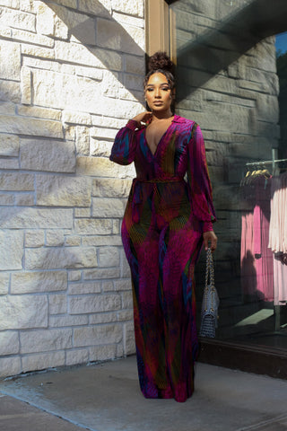 black woman posing in purple dress