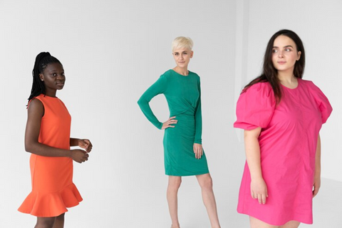 group of 3 models wearing pink green and orange dress