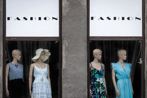 outside display view of a shop showing 4 mannequins