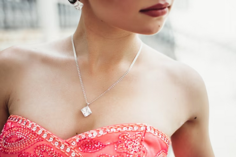 necklace on woman's neck with deep neckline