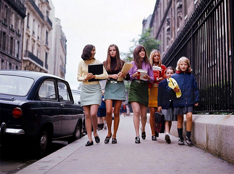 a group of women in 60's fashion of miniskirts