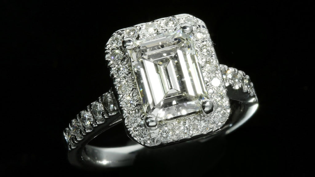 Emerald cut halo engagement ring