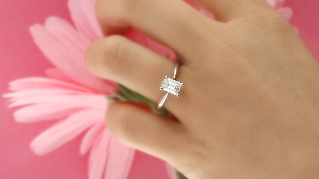 Solitaire emerald cut engagement ring