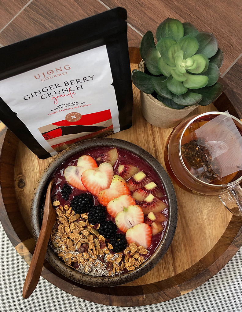 Super Berry Smoothie Bowl served with Ujong granolas and fruits, paired with a cup of Gryphon tea