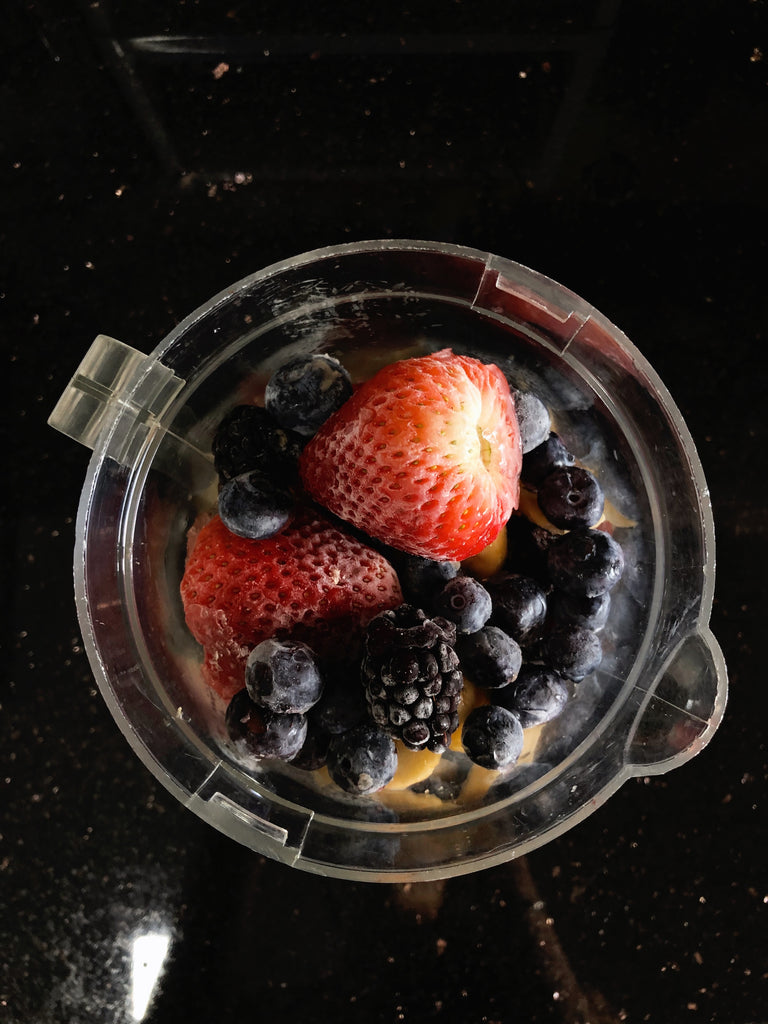 Frozen mixed berries in a blender