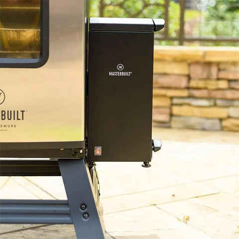 A black Masterbuilt Slow Smoker is attached on the right side of a stainless steel vertical smoker.