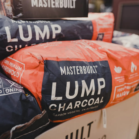 A big pile of bags of Masterbuilt lump charcoal