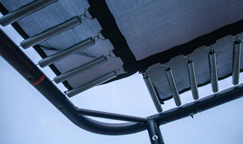 Trampoline frame, springs and mat seen from below