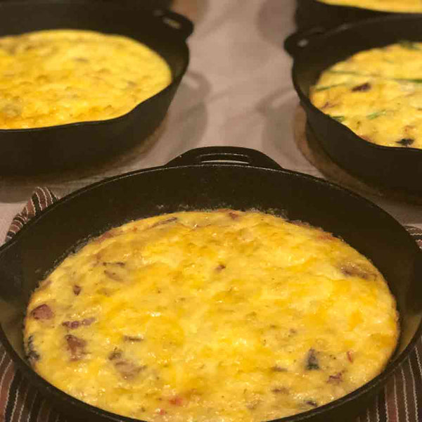 A cheesy beef Frittata in a cast iron skillet, prepared for brunch