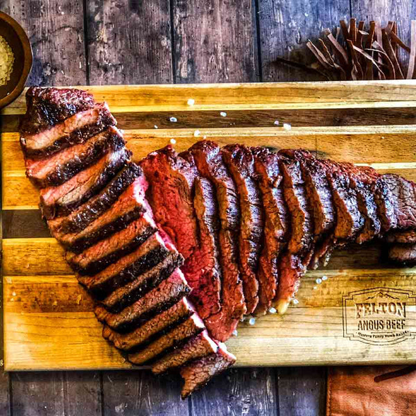 A grilled tri-tip, sliced and ready to serve for a holiday meal.