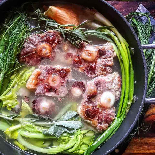 Oxtail stewing in a pot