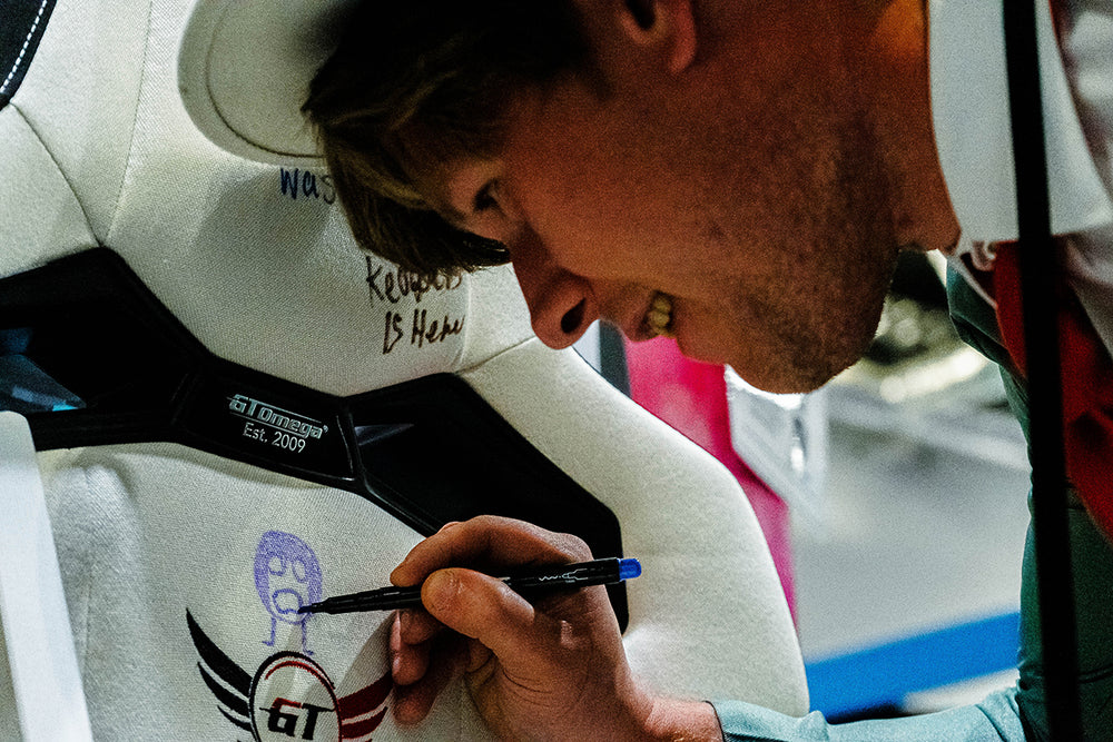 A visitor to the GT Omega Exhibition stand is drawing Hank on the GT Omega Scribble Seat