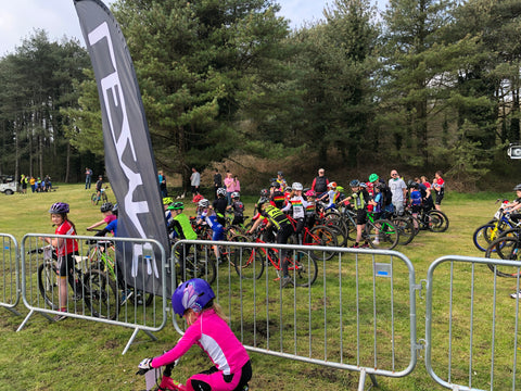 Children lined up at the start of a bike race