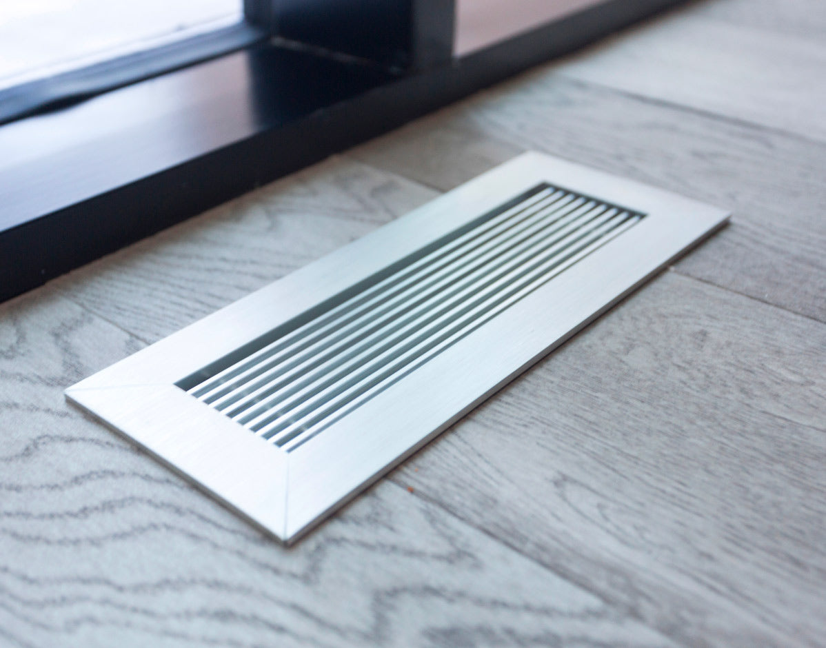 kul grilles anodized clear vent cover on modern hardwood floor