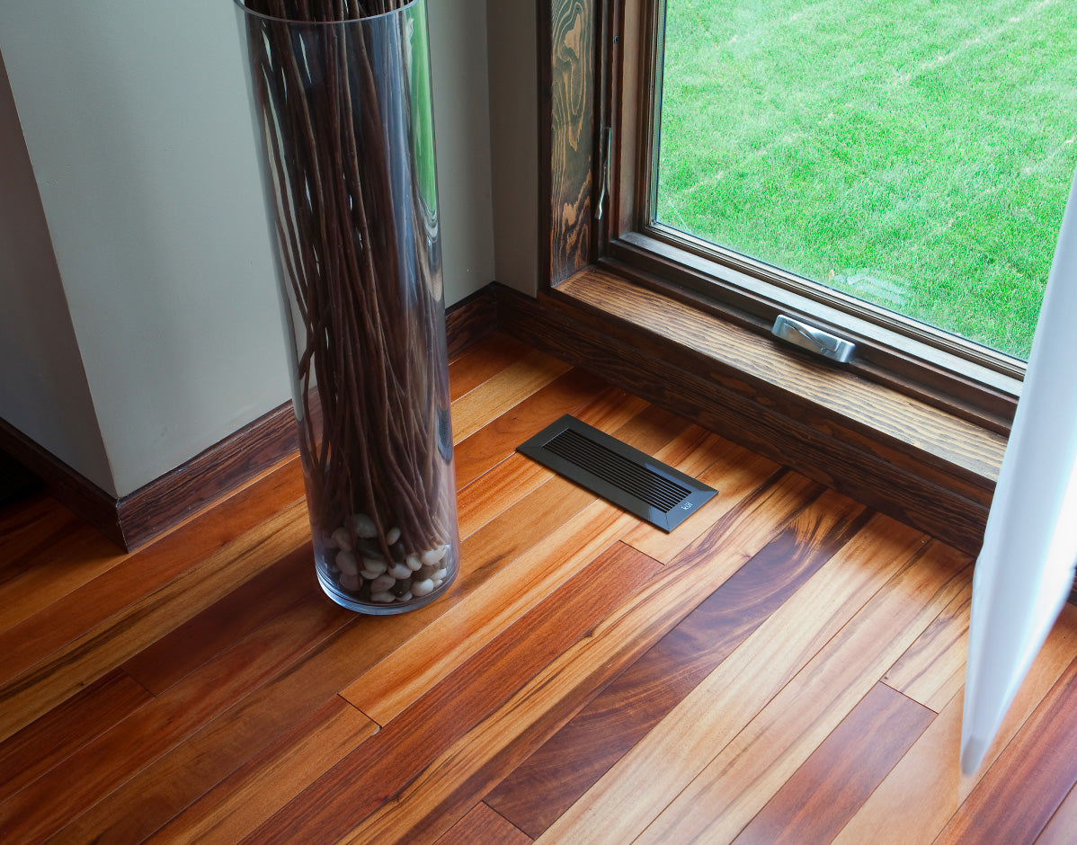 black monolith kul grilles floor vent covers on hardwood flooring by large window