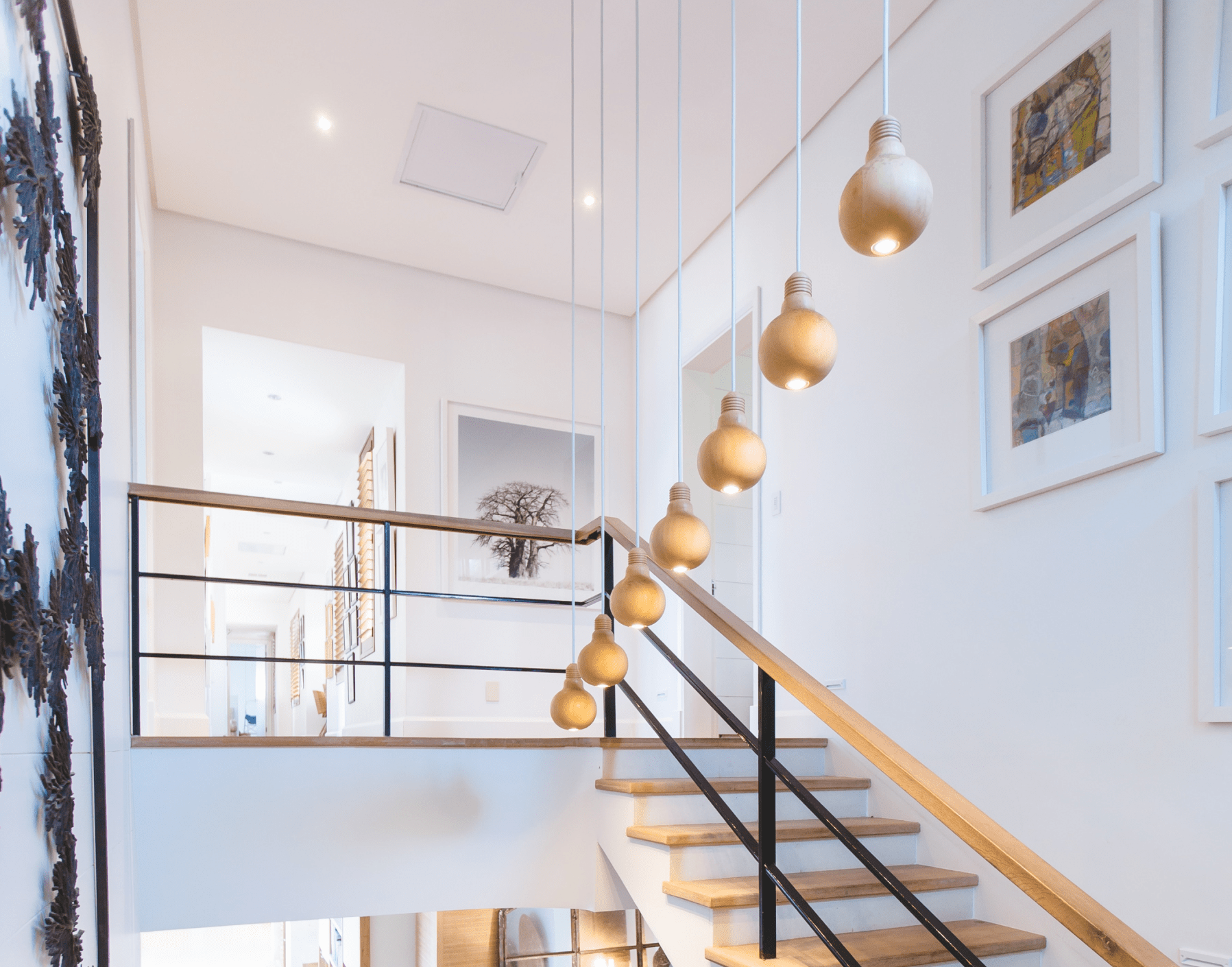 contemporary stairway with pendant lights