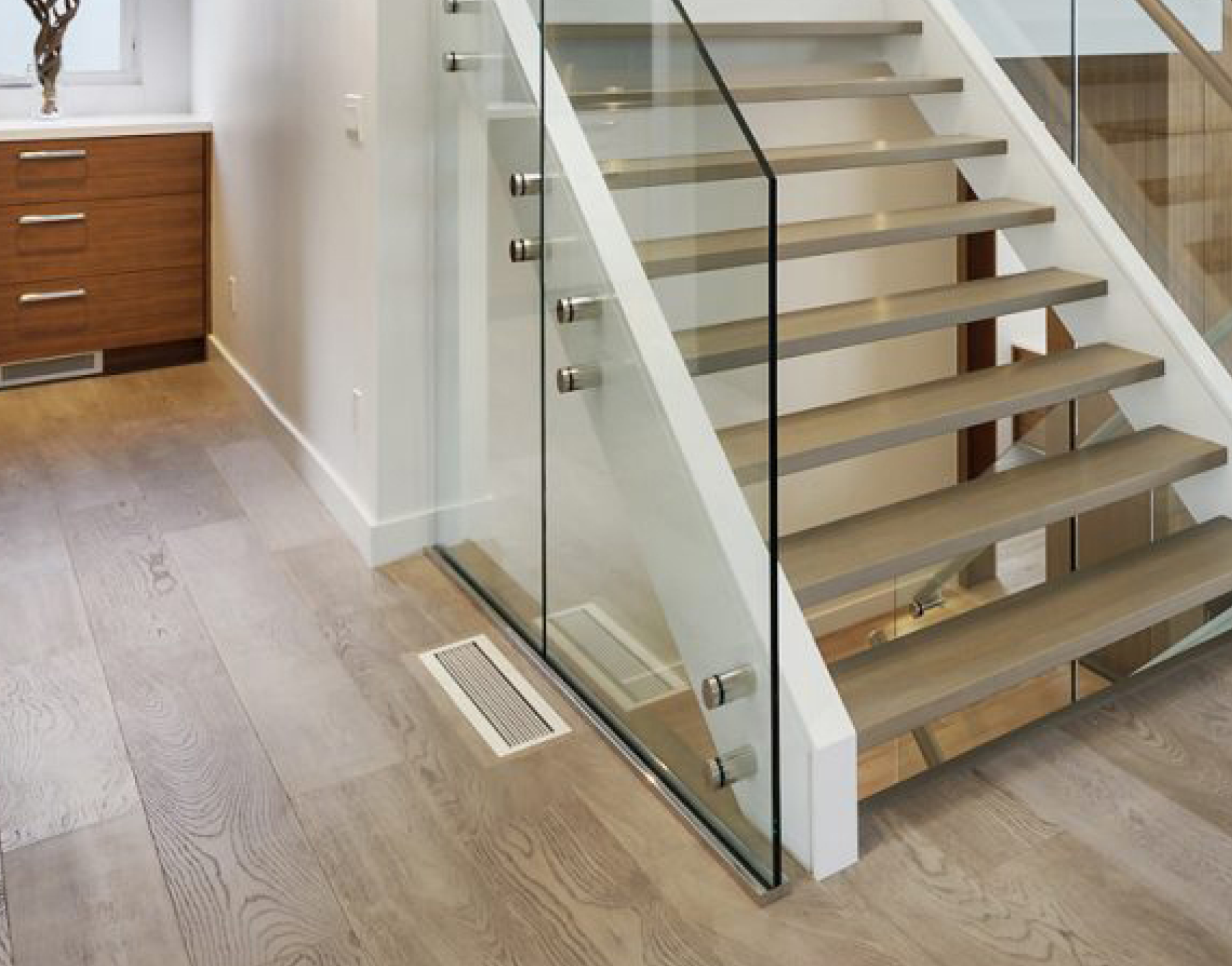 kul grilles Glacier Frost vent cover in contemporary hallway by glass walled staircase