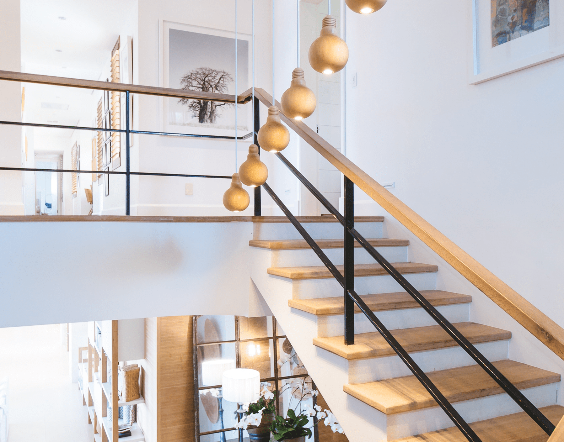 luxury stairwell with pendant lighting