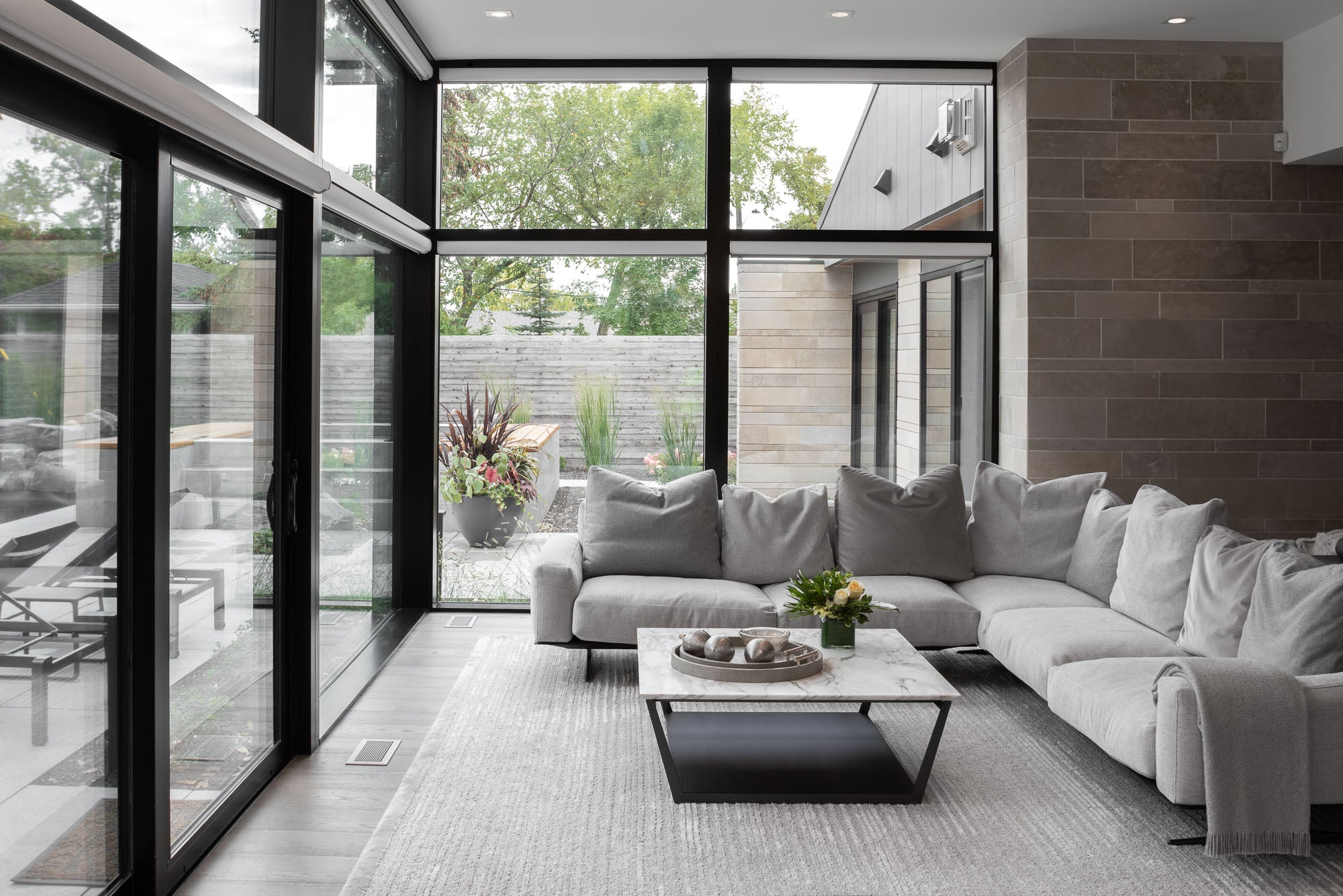 Modern living room in Steinbach, Manitoba with brushed chrome vent covers kul grilles