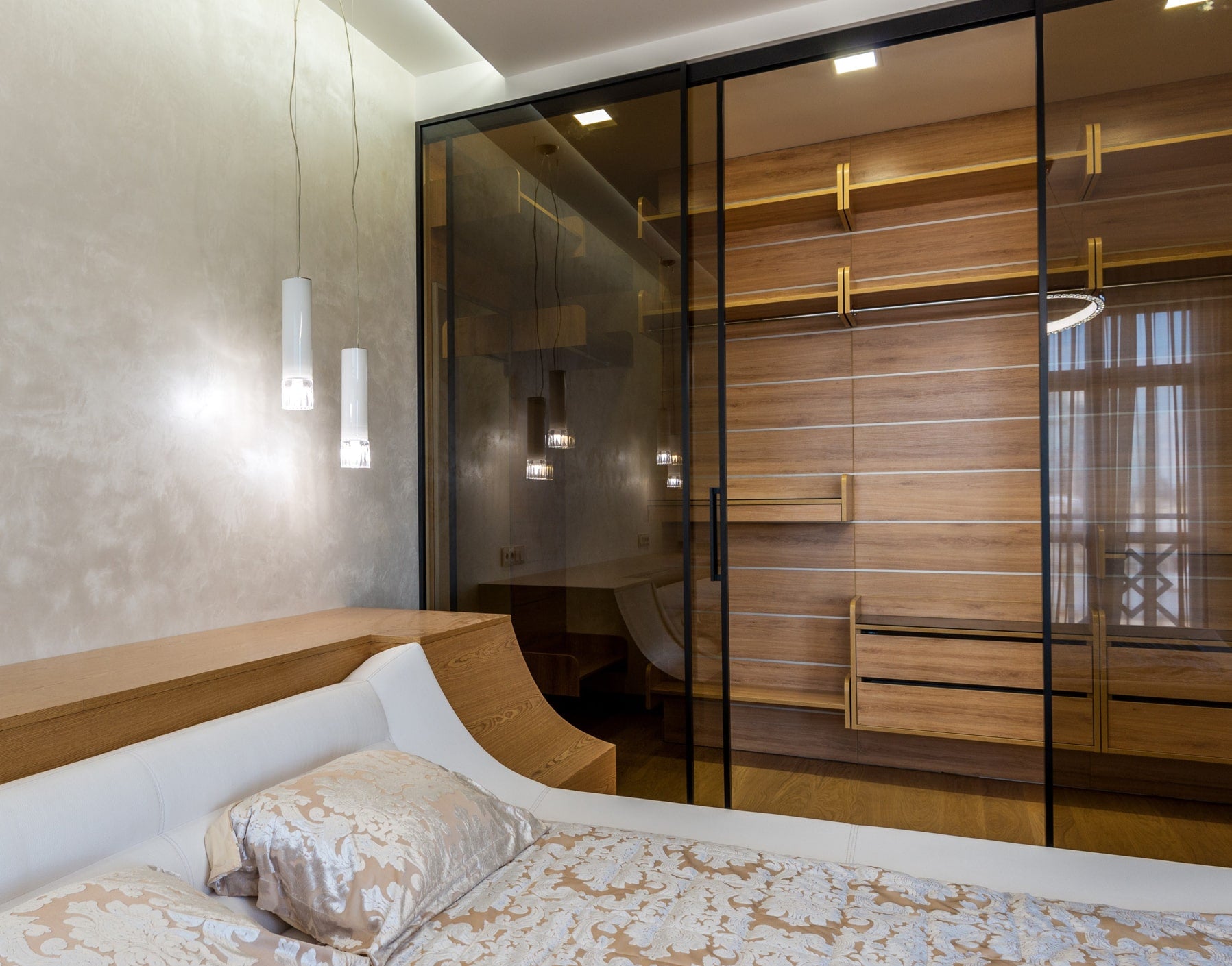 modern minimalist bedroom with hidden storage walk in closet