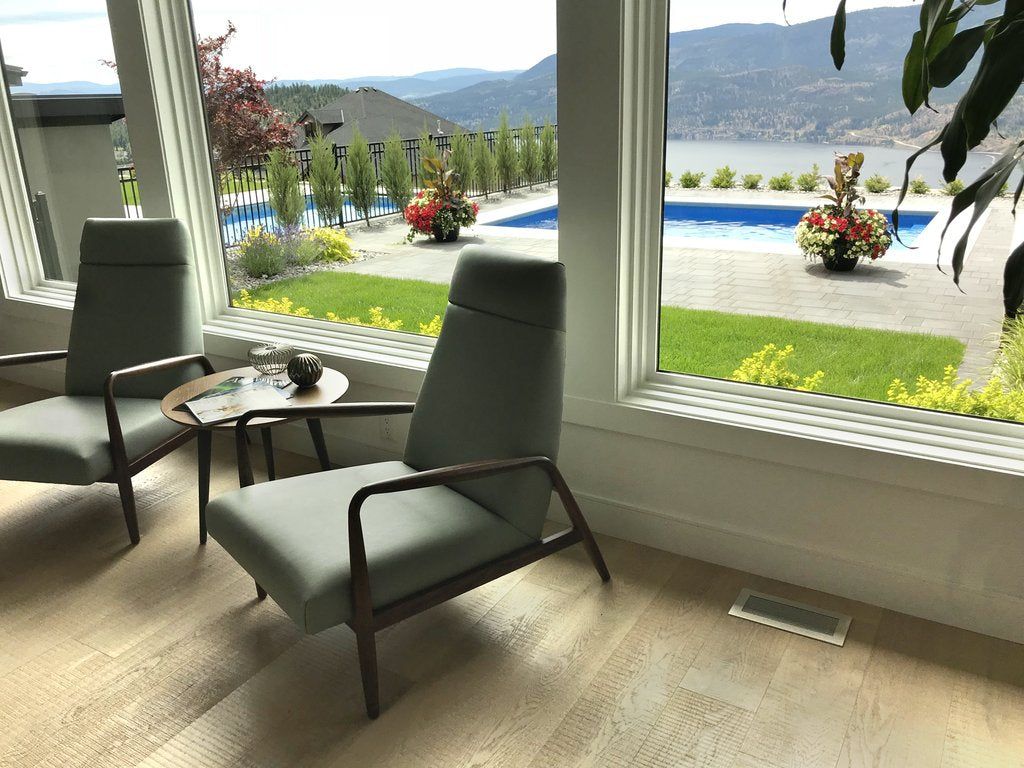 vent covers brushed chrome finish on light oak harwood flooring white walls and window casings wilden builders kelowna showhomes by kulgrilles