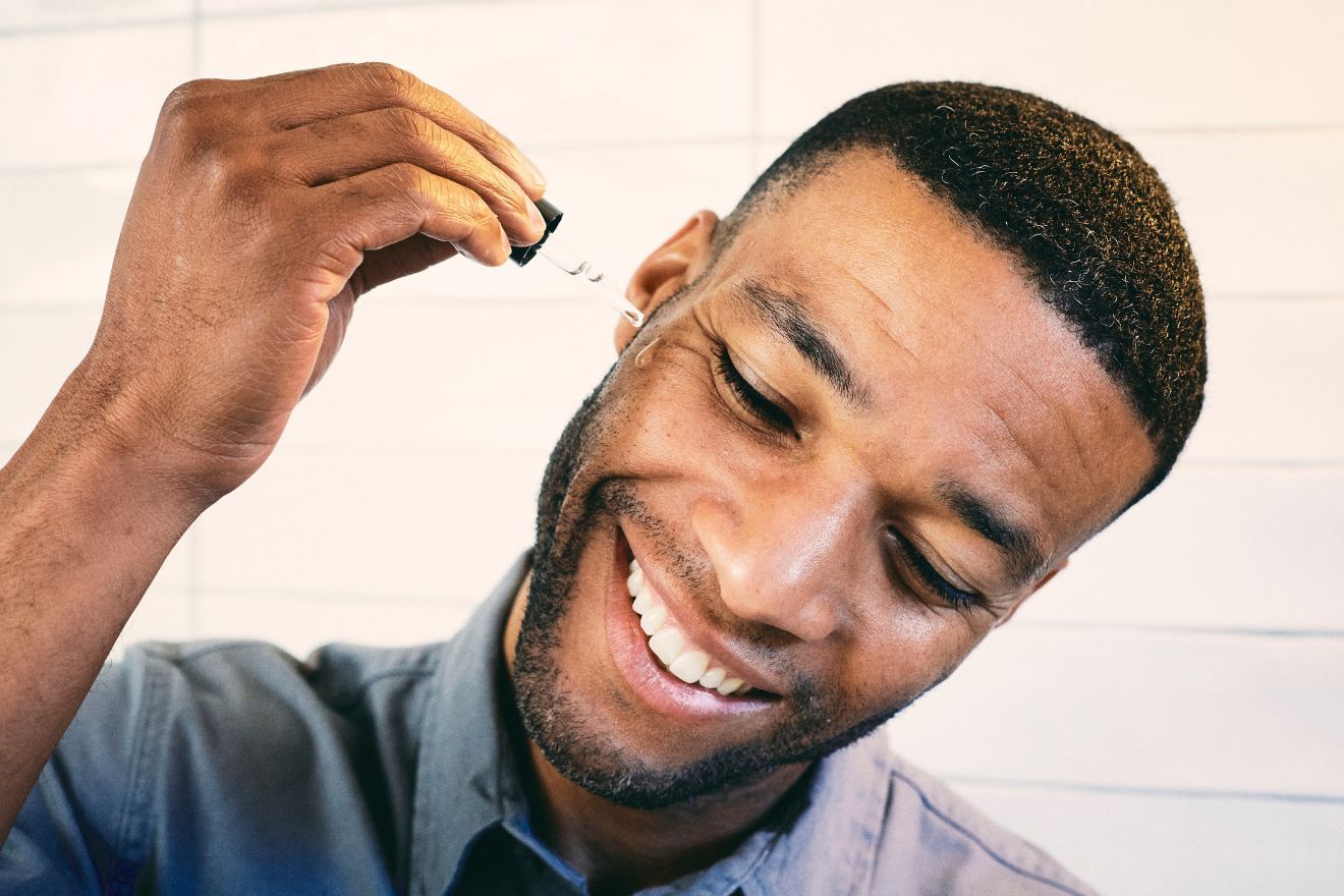 Man applying skincare product