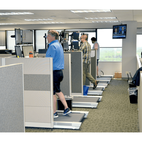 Several Unsit Treadmill Desks being used in cubicles in a Multi-Bank Securities Office