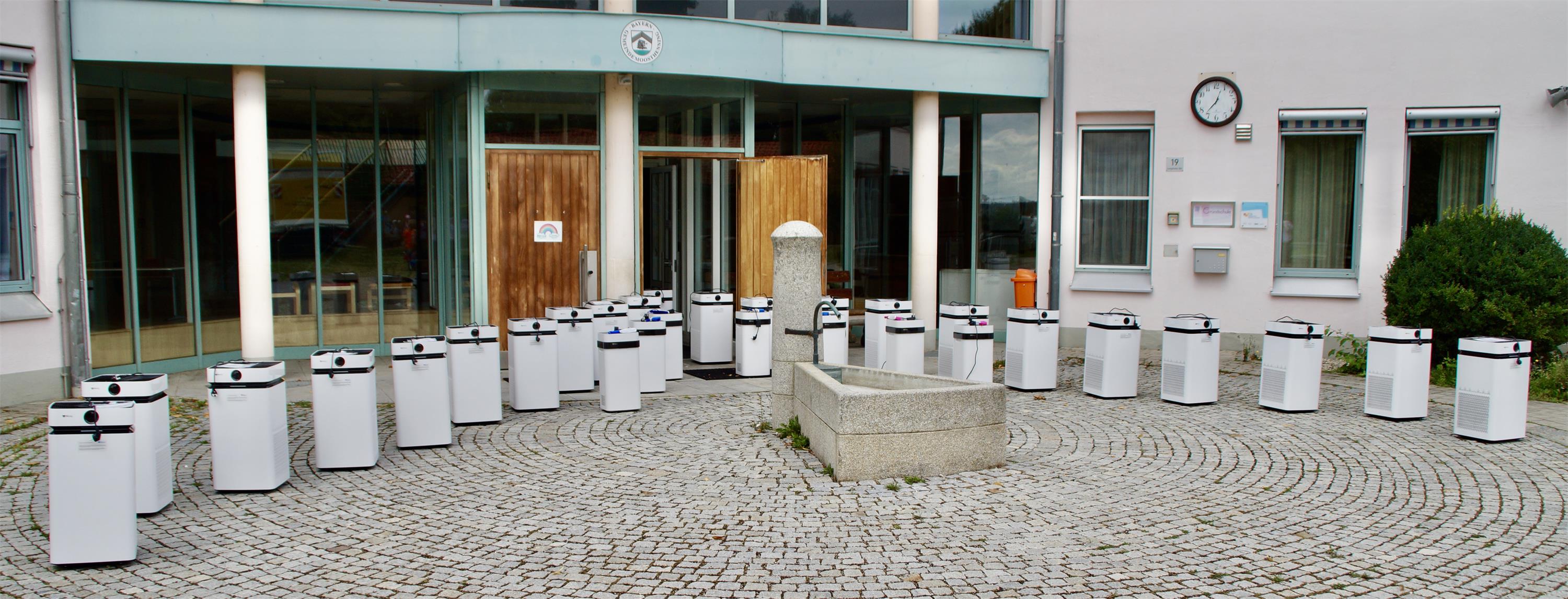 airdog x8 air purifiers in front of german school