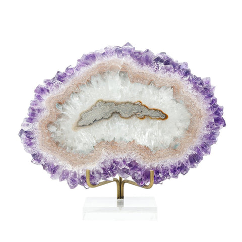 A slice of an amethyst stalactite highlighting purple exterior crystals and a banded agate interior