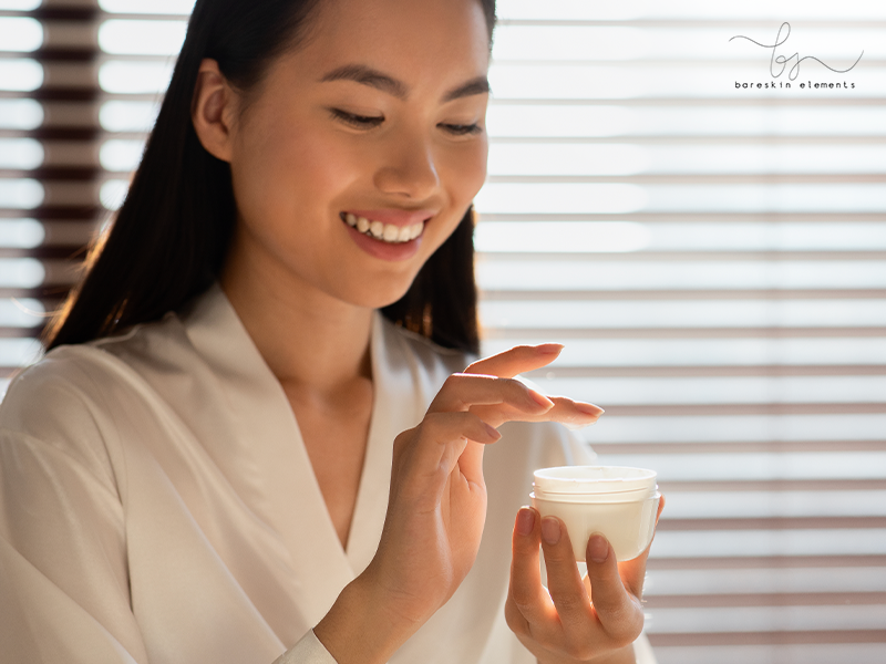 Smiling Lady Holding Jar With Beauty Product