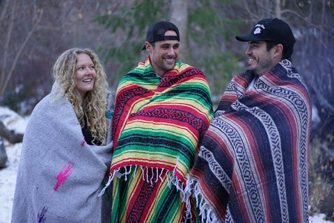Group wrapped in Mexican Handwoven Blankets in the mountains