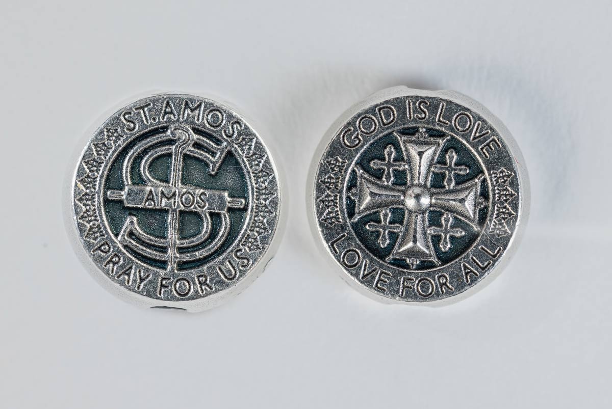 close up of the share the love st. amos medal front and back