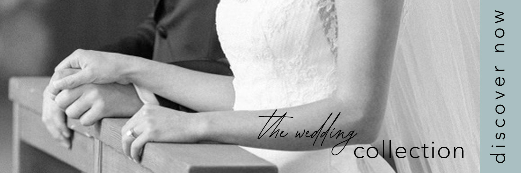 shop the wedding collection black and white photo of man and woman holding hands at the nuptial altar