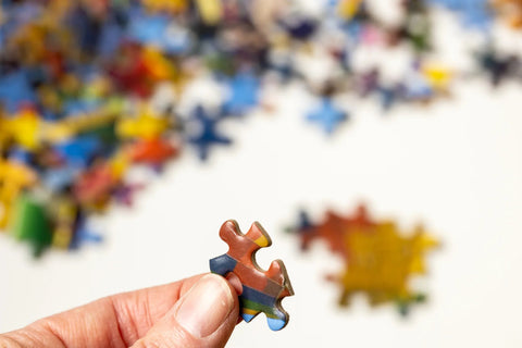 Close up of a jigsaw puzzle piece; photo courtesy of Pexels