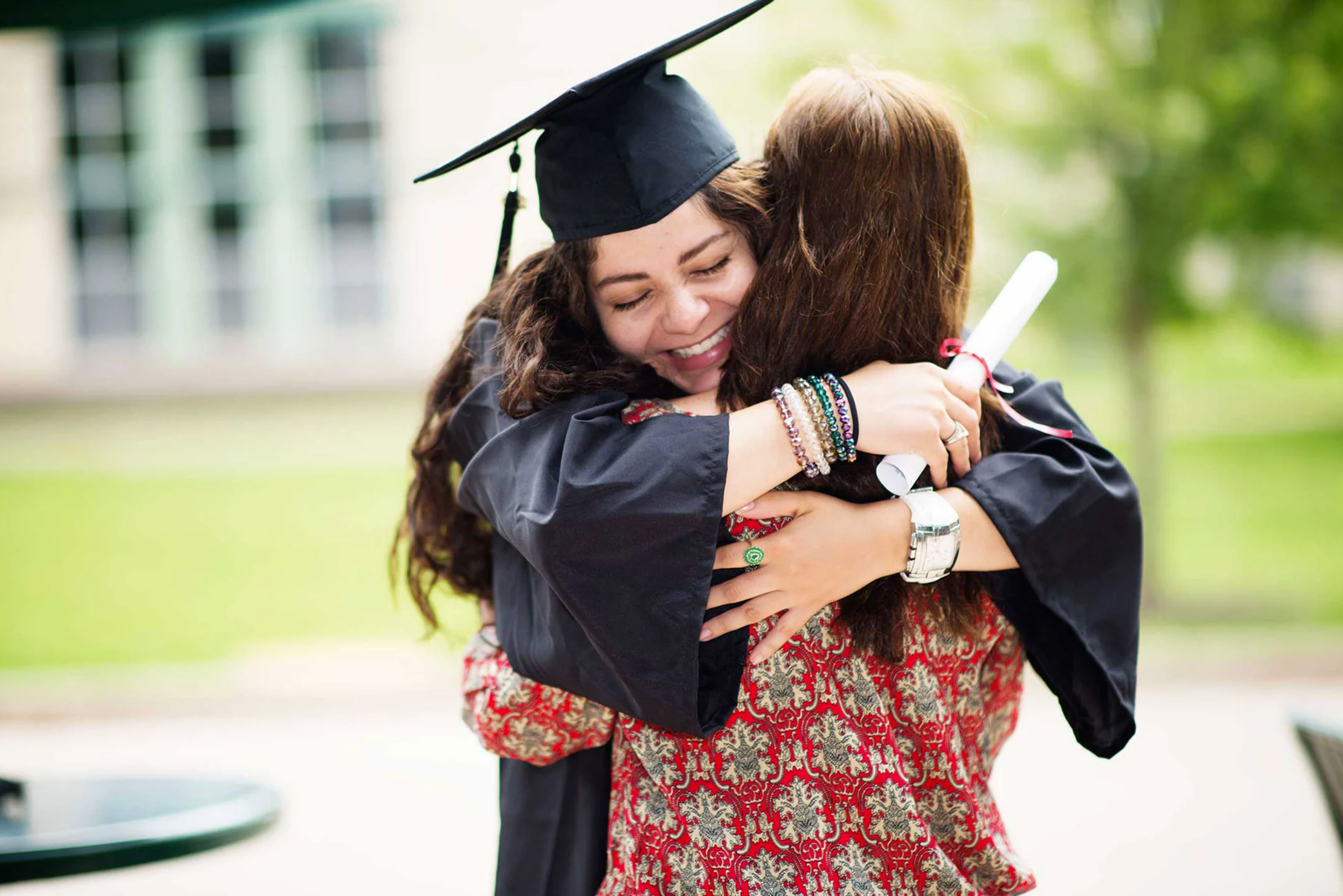 mother and daughter hugging during graduation