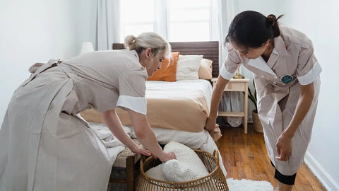 what should a housekeeper wear: maids making the bed