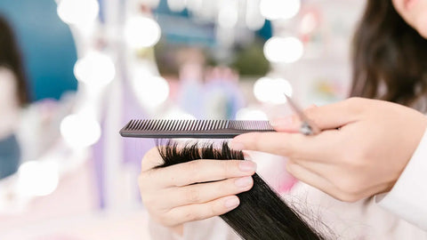 what uniform is best for hairdresser: Trimming hair with a comb