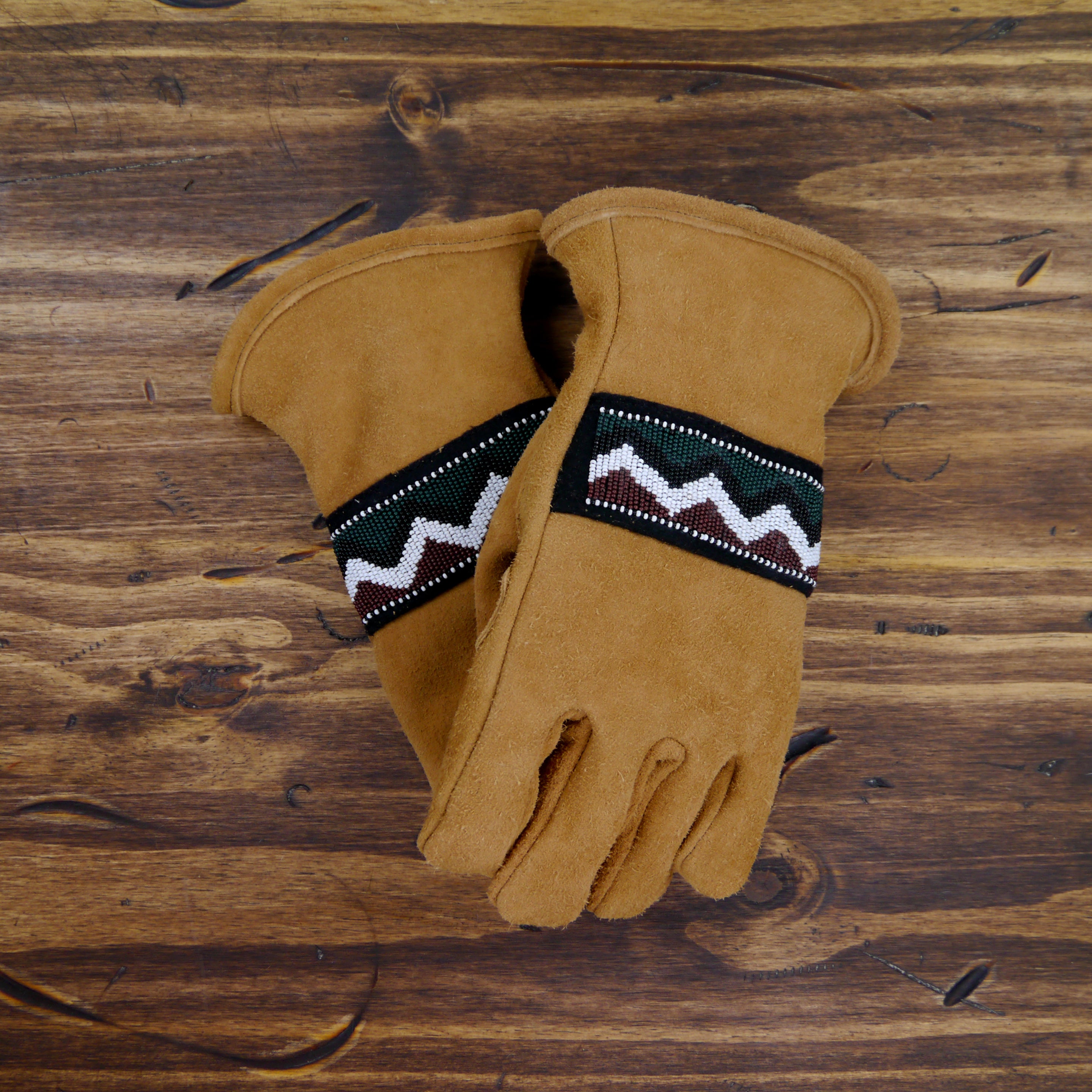 black and brown leather gloves