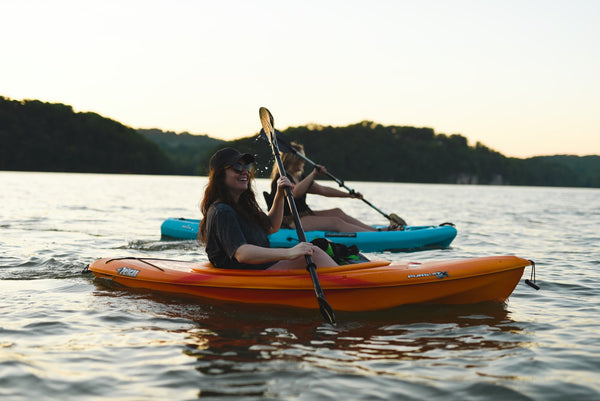 Girls on a kayak boat