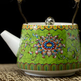 closer side view of green Chinese royal style famille-rose teapot