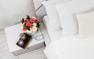 Bedside Table with Floral Arrangement