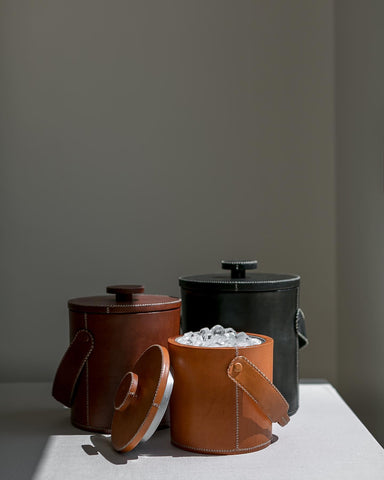 A picture of leather ice buckets.