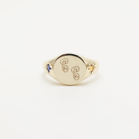 Custom engraved 14k yellow gold signet ring featuring star set sapphire and topaz