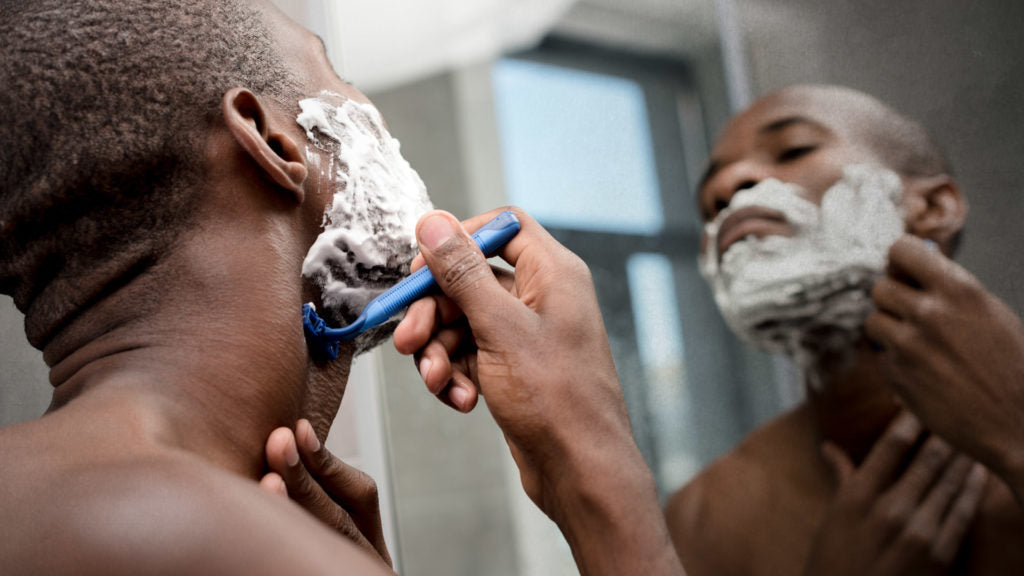 man with shave cream on beard