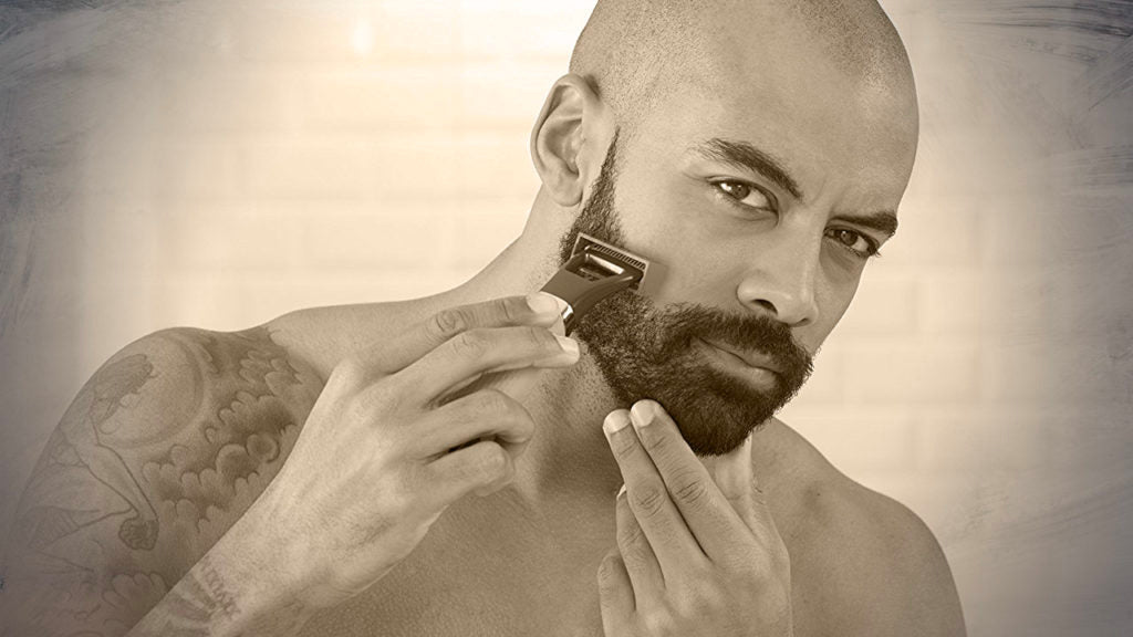 bald man shaving his beard