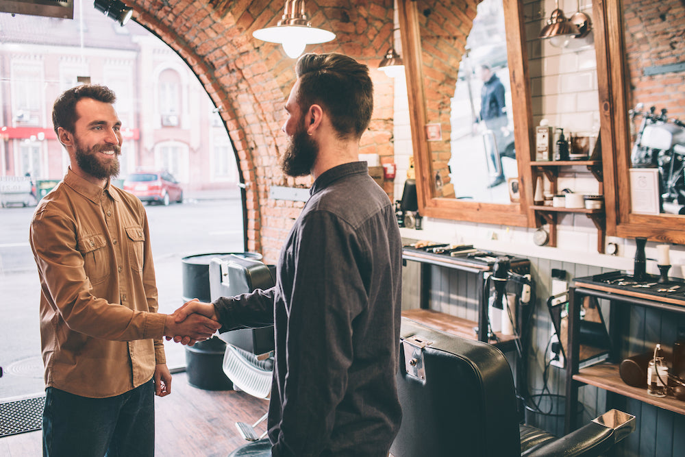 bearded men in handshakes