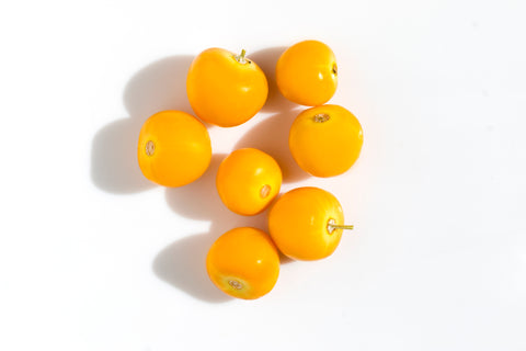 Mirabelle plums on a white background