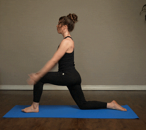 Woman demonstrating Low Lunge to Half Splits exercise