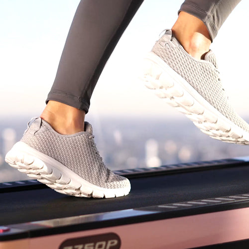 a woman is running on treadmill