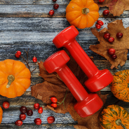 a pair of dumbbells with pumpkins